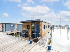 Welcoming house boat in Volendam with jetty